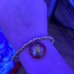 Cute gold bracelet with flower charm